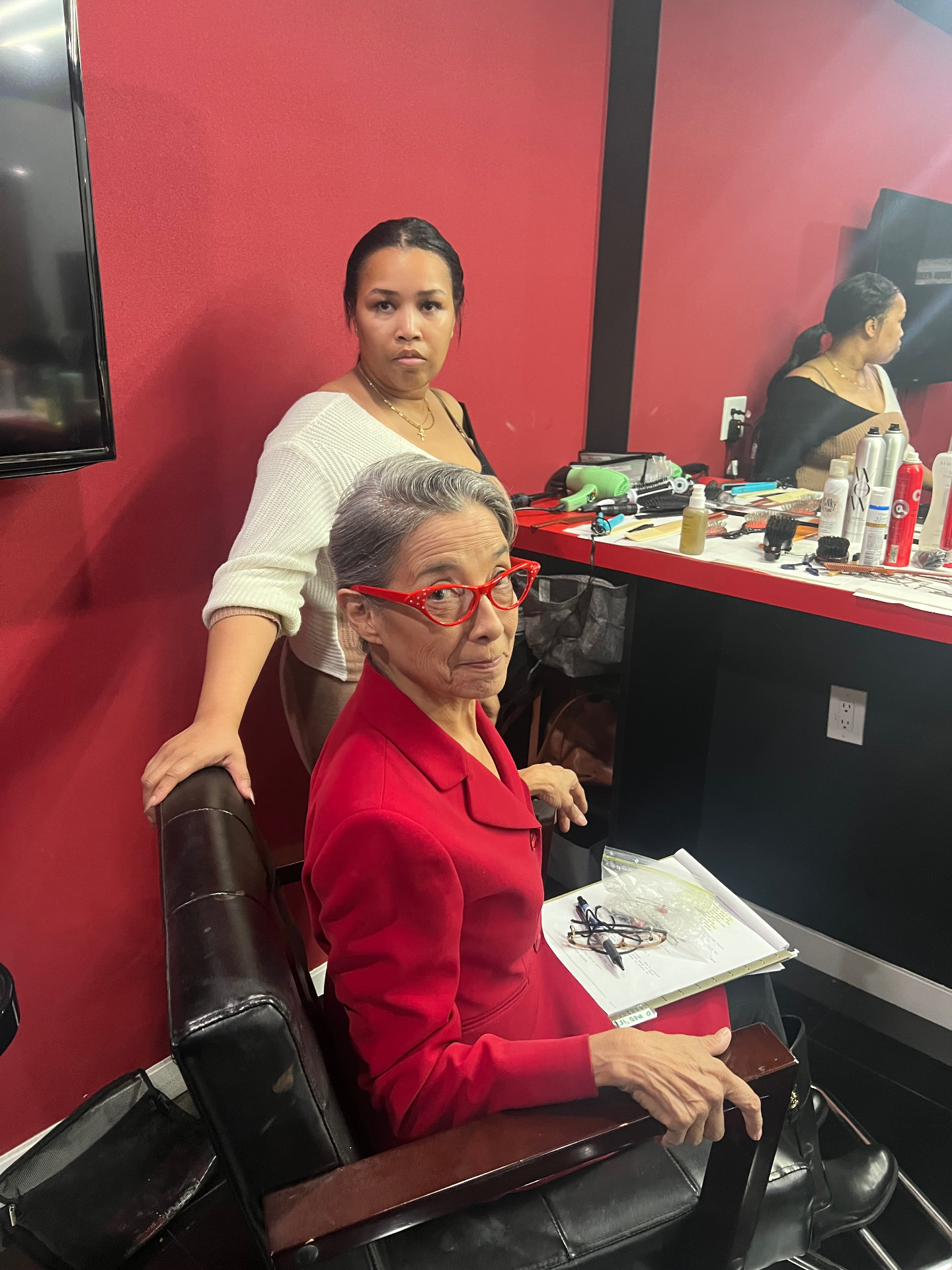 Dogbelly cast member in red during makeup and prep behind the scenes.