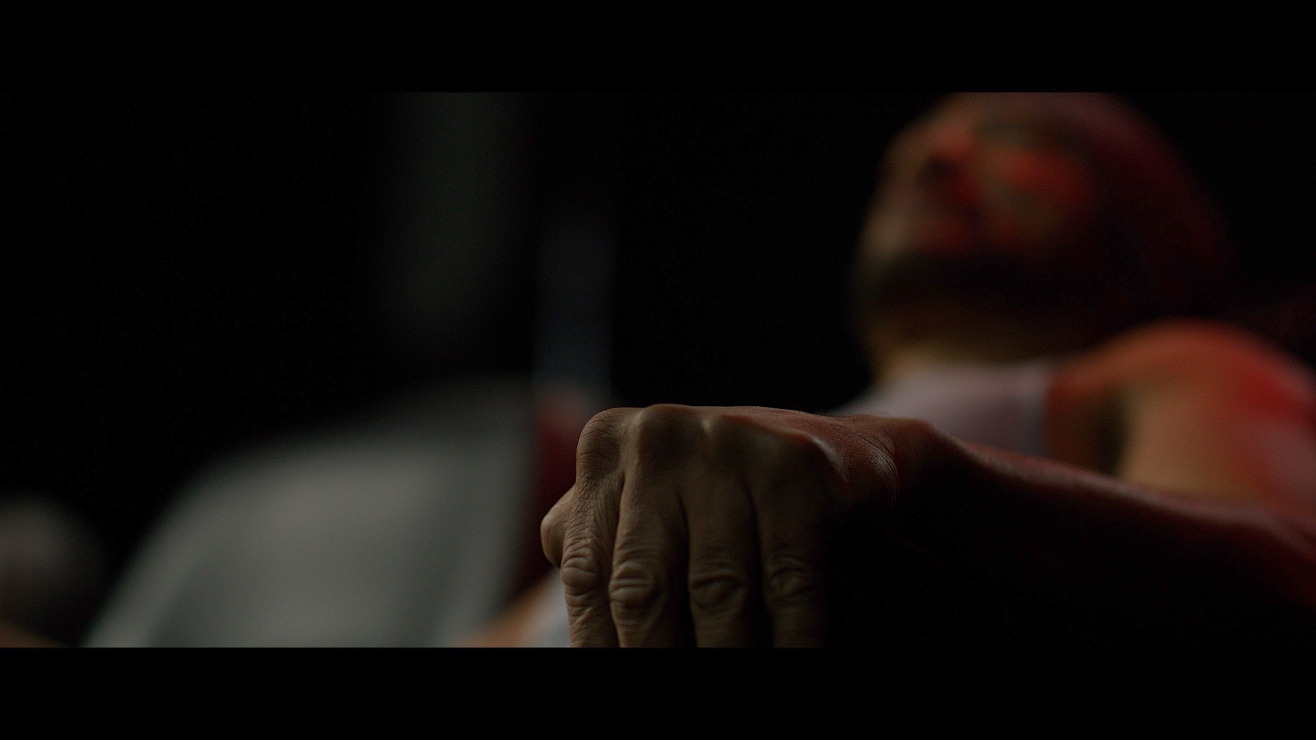 Moody cinematic still from Dogbelly highlighting a featured shadow.